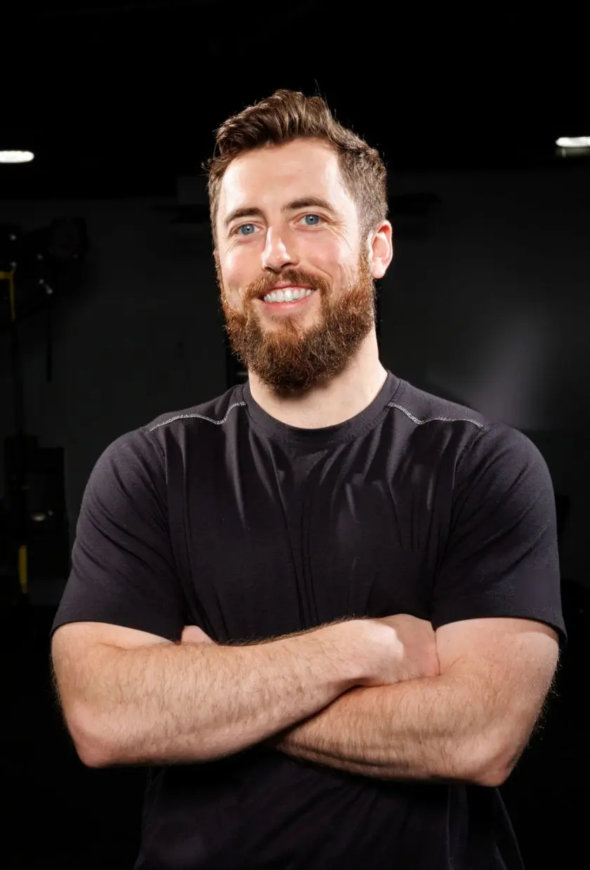 Trainer Terry smiling with his arms crossed